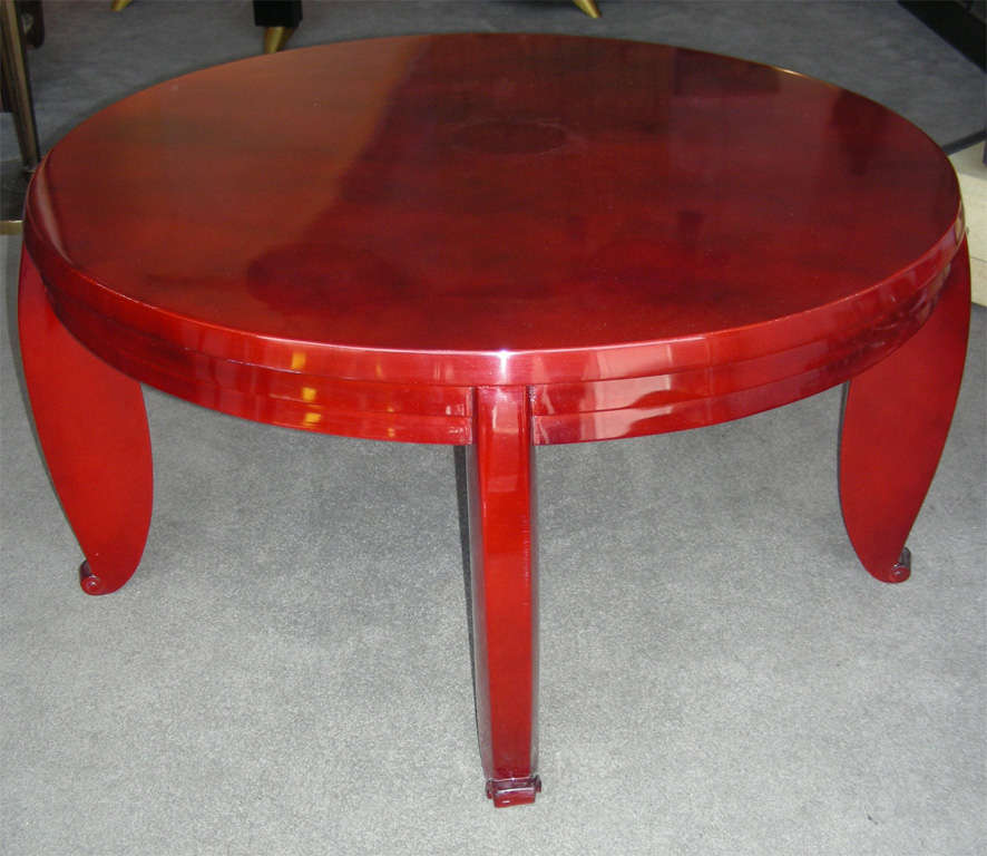 Circa 1915 coffee table attributed to Jean Pascaud, in clouded red lacquer.