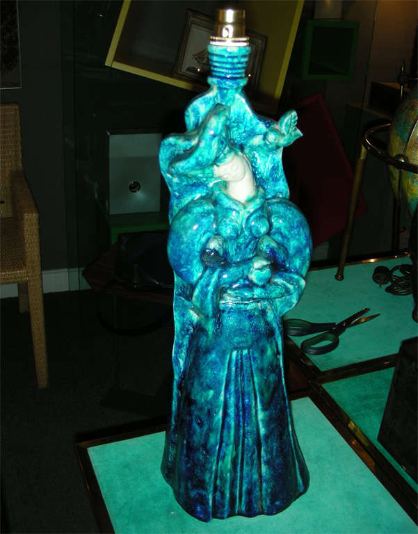 1950s ceramic lamp base representing a woman in a long dress; signed RBonfil and stamped 