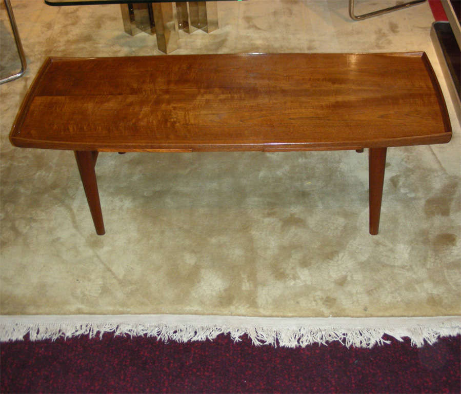 Swedish 1950s teak coffee table by Alf Svensson, with stamp under top surface. Two integrated pull-out tablets.