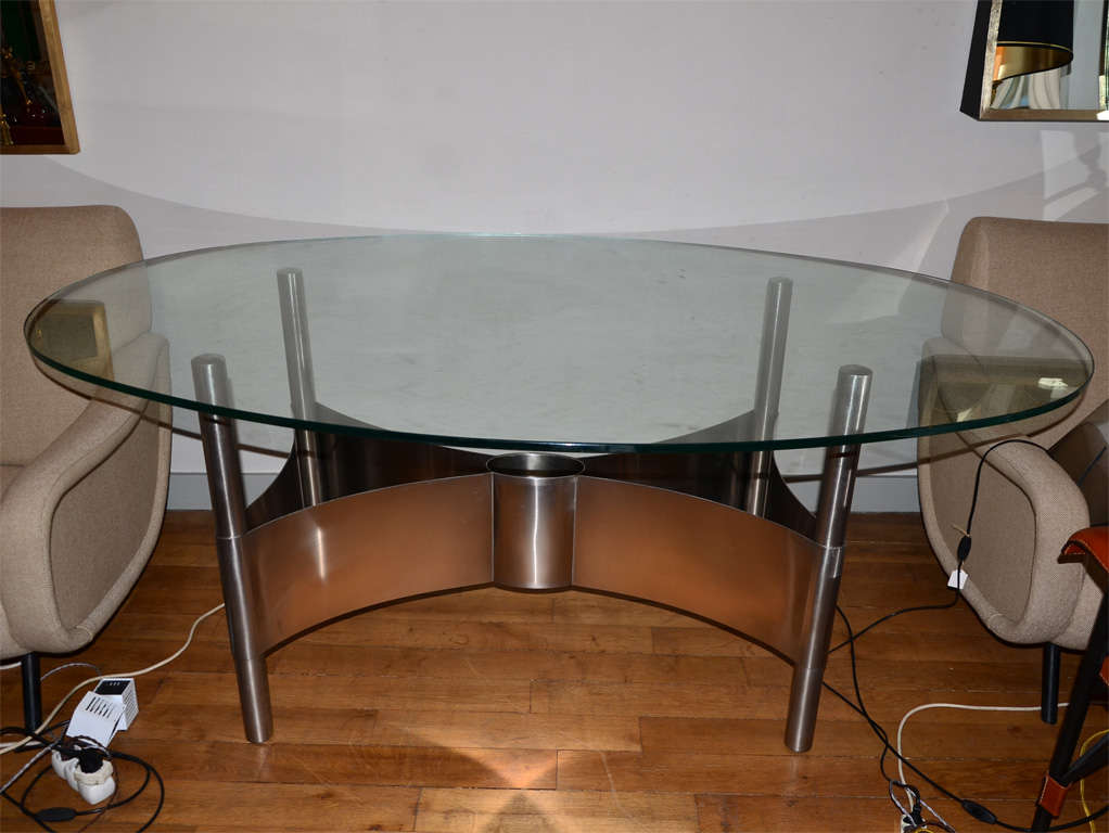 1970s table with base in steel and glass top.