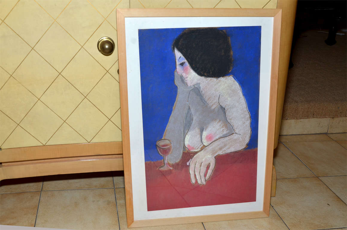 1962-1970 painting in pastels by Anna Silverberg, representing a nude woman seated at a table with a glass of wine against a blue background. Framed in plexiglass and wood.