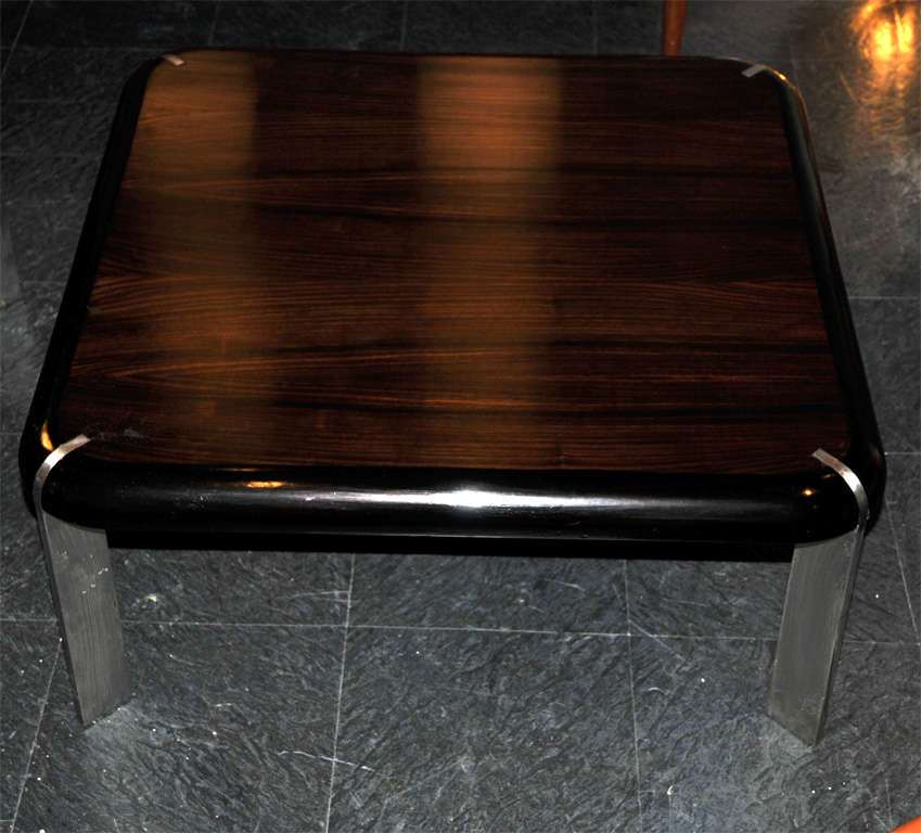 Two 1970s coffee tables in Makassar ebony and stainless steel.