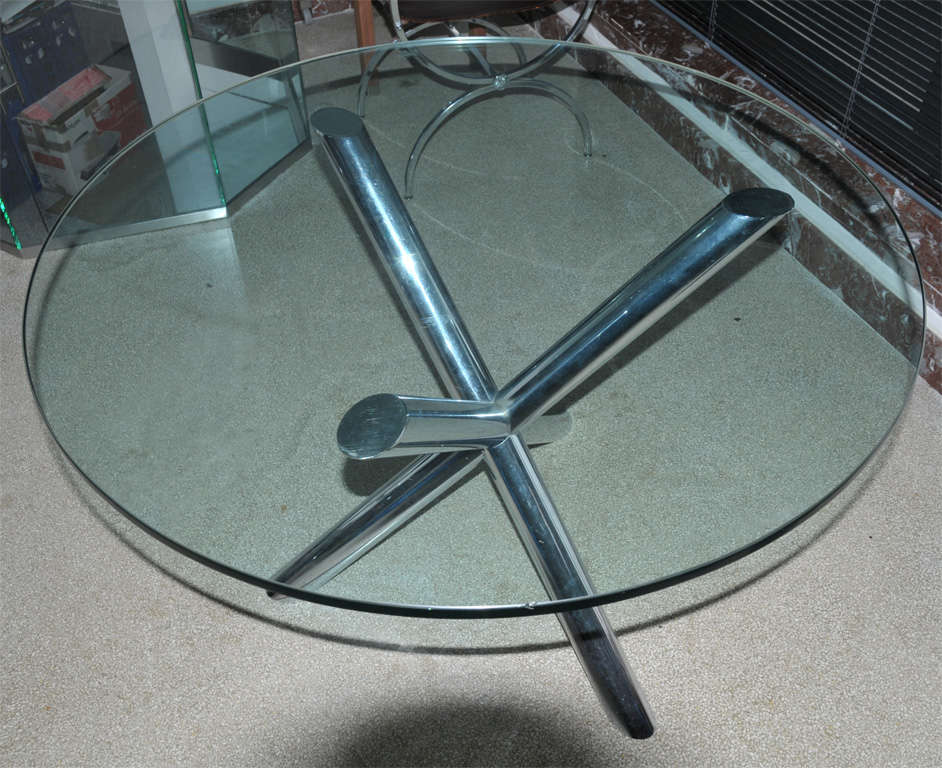Elegant circular dining table, glass top and chrome