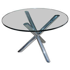 Elegant circular dining table, glass top and chrome