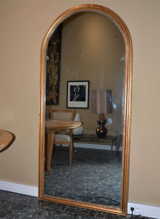 Large 1830s mercury mirror framed in wood gilt with gilding leaf.