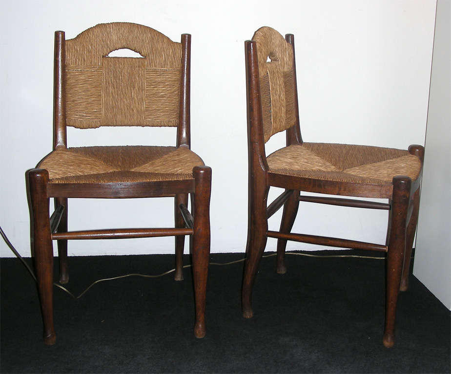 Pair of brown wood and rush chairs 