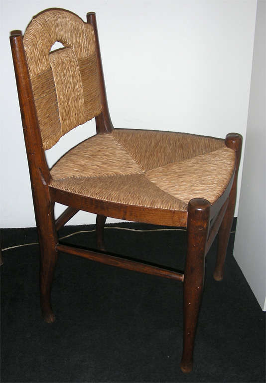 French Pair of  wood and rush chairs by  J.E. Ruhlmann.