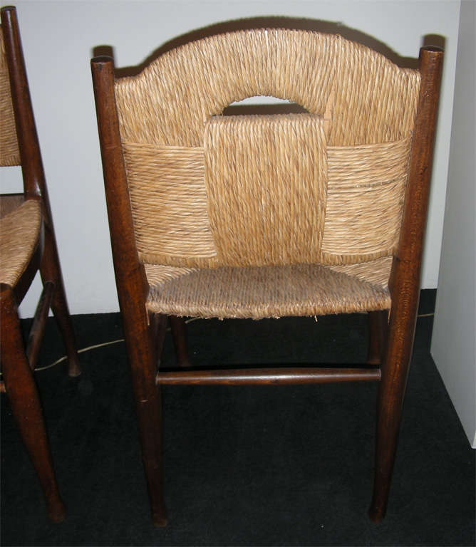 Mid-20th Century Pair of  wood and rush chairs by  J.E. Ruhlmann.
