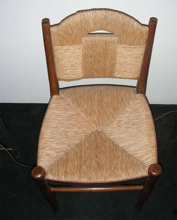 Pair of  wood and rush chairs by  J.E. Ruhlmann. 1
