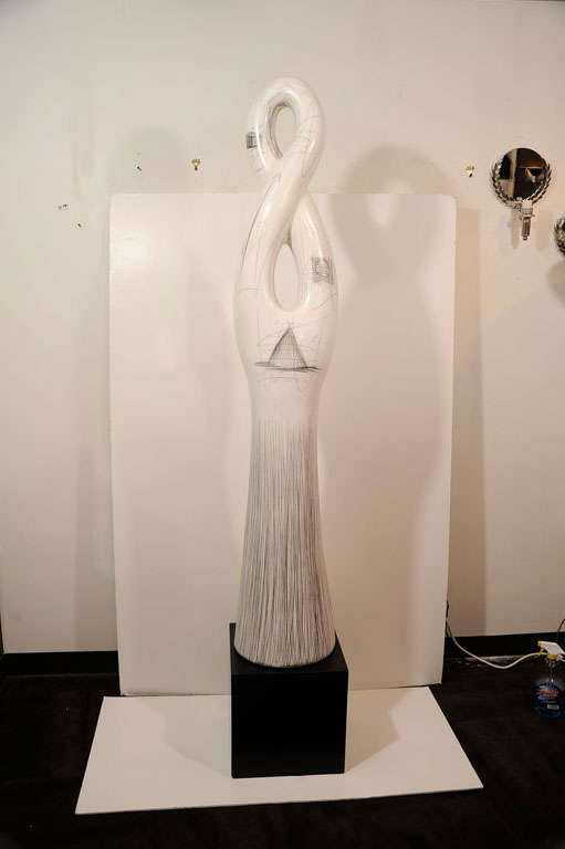 Abstract sculpture on ebonized <br />
wood pedestal, by contemporary<br />
artist Yuri Zatarain.  Sculpture<br />
is comprised of ivory matte glazed<br />
ceramic with pencil markings<br />
throughout.  82