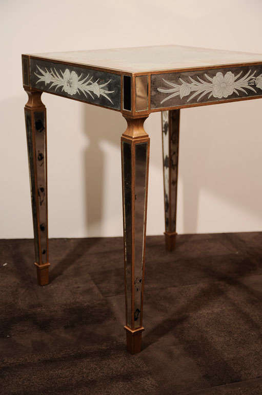 Exquisite occasional table with <br />
eglomise mirrors throughout<br />
with botanical illustrations,<br />
and with anitque mirrored<br />
panels and giltwood.