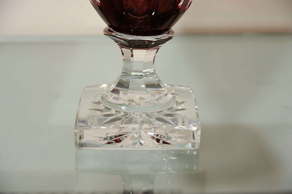 Cranberry cut-glass with gold leaf figured frieze.