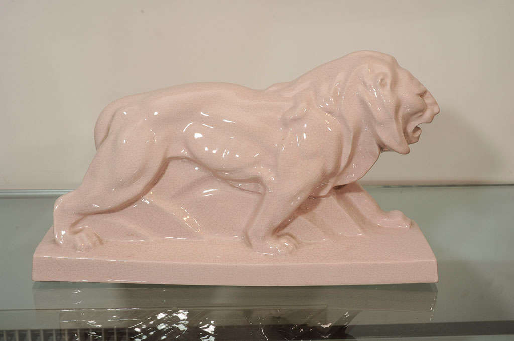 Rosey white crackle ceramic prowling lion.