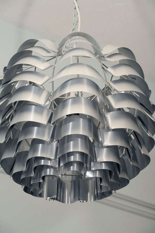 Striking hanging fixtures by Max Sauze, made of folded aluminum, they give a very interesting light. priced for one