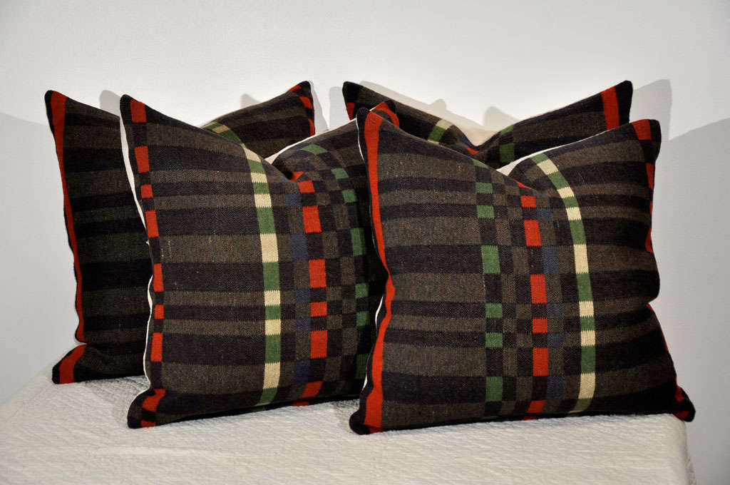 19TH C. WOOL HORSE BLANKET PILLOWS WITH HOMESPUN LINEN BACKING. DOWN FEATHER INSERTS. MIXED COLORS OF GREY, ORANGE, GREEN AND BLACK. THESE PILLOWS ARE SOLD INDIVIDUALLY FOR 295 EACH / FOUR IN STOCK