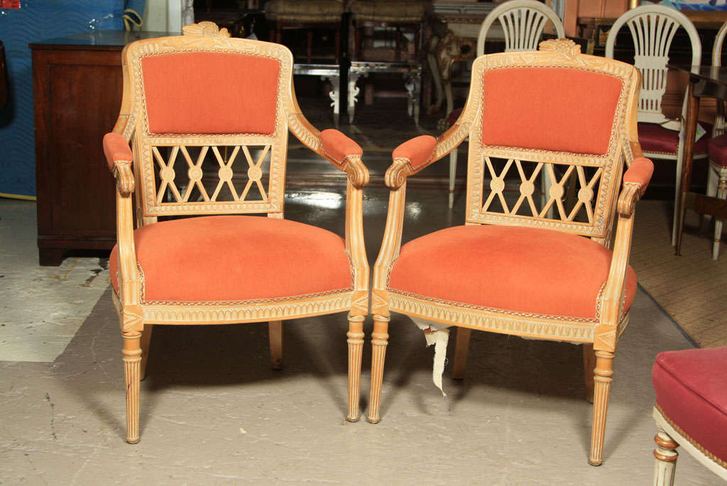 Pair of chic and beautifully carved armchairs, in the style of French Directoire, upholstered in soft orange velvet.