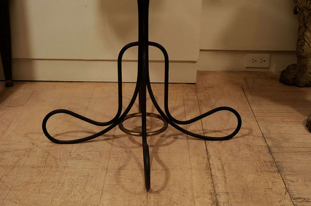 An Eglomise and Parcel Gilt Iron Table