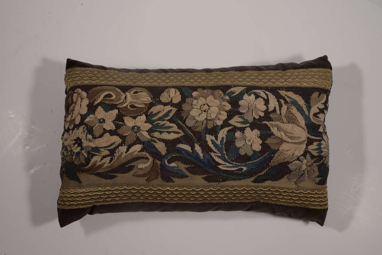 18th Century tapestry fragment lumbar pillow constructed with 100% cotton velvet in rich chocolate hue. Tapestry is bordered with antique gold ribbon. Down filled.