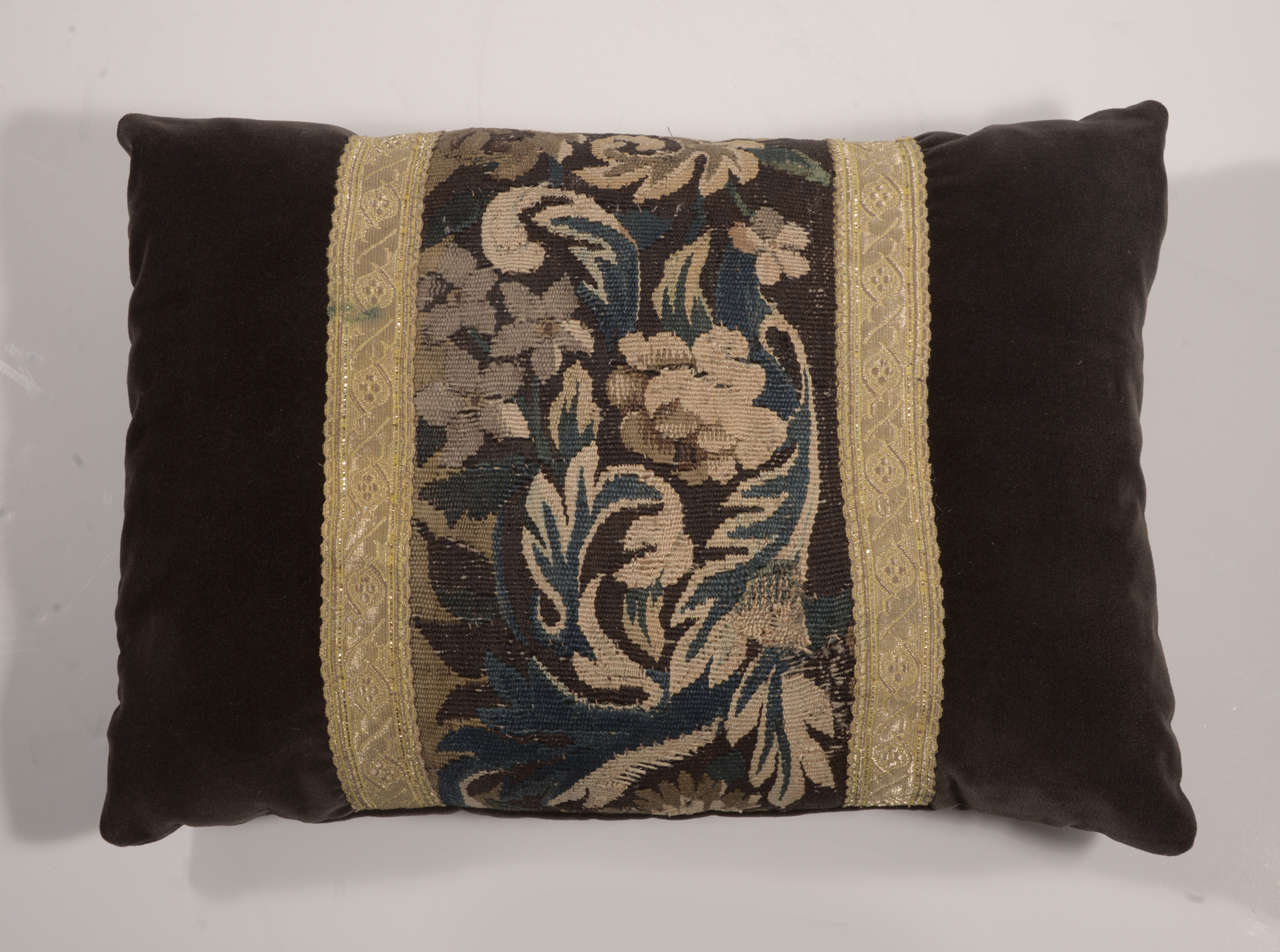 Beautiful florals and leafs are depicted in golds, browns and blues in this pillow. It is made from a 19th century French tapestry remnant and antique gallon ribbon onto a dark chocolate velvet. Custom-made by Maison with to the trade fabrics.