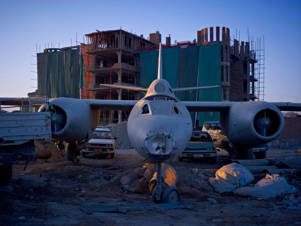 Simon Norfolk Color Photograph - A Dumping Ground For An Abandoned Russian-Era Bomber