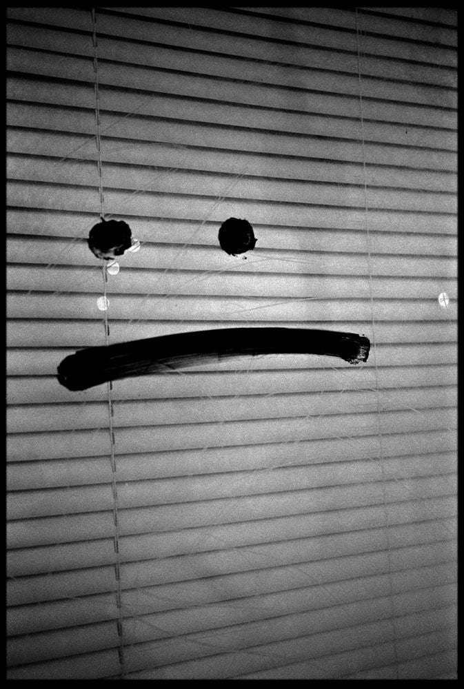 Ted Adams Black and White Photograph - Frown Face