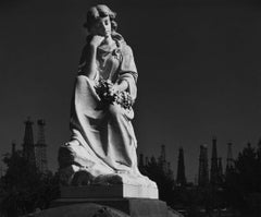 Cemetery Statue and Oil Derricks. Long Beach, CA 1939