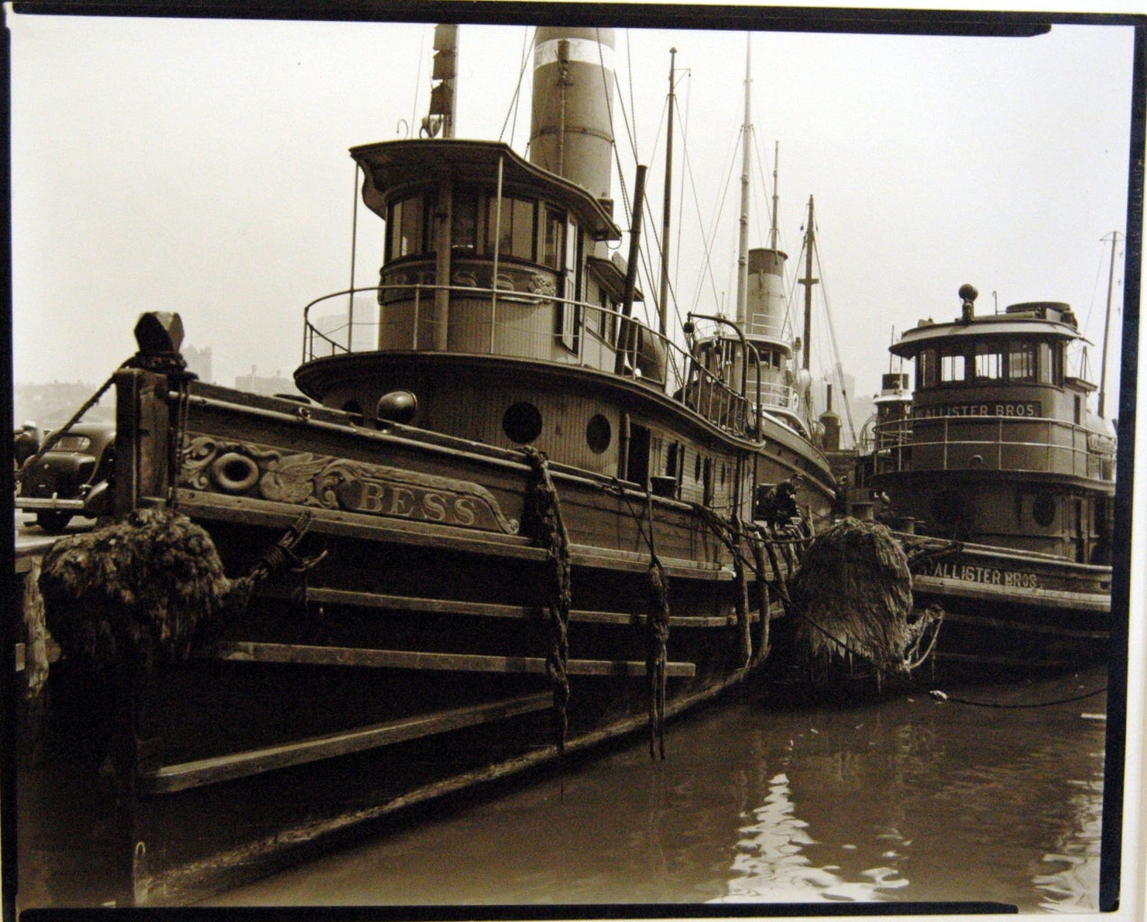 Berenice Abbott Black and White Photograph - Tugboats, Pier #11, East River