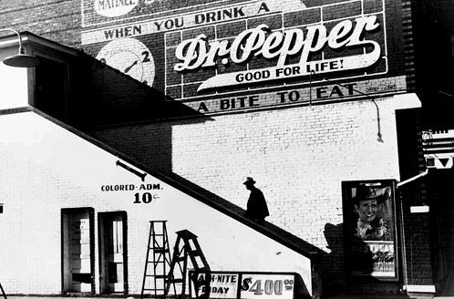 Marion Post Wolcott Black and White Photograph - Man Entering Movie Theatre by Colored Entrance. Belzoni, Mississippi