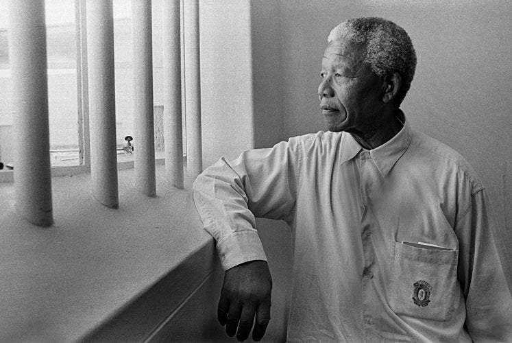 Jürgen Schadeberg Portrait Photograph - Nelson Mandela in his cell, Robben Island (Revisit)