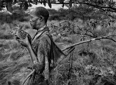 Bushman, Botswana [man with bird]