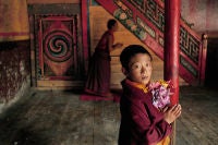 Young monk with flowers, Larung Gar, Kham, Tibet