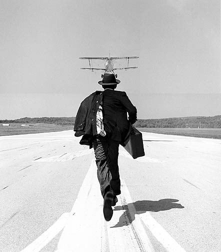 Rodney Smith Black and White Photograph - A.J. chasing airplane, Orange County Airport, New York 1998