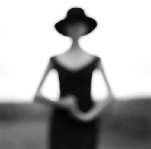 Rodney Smith Black and White Photograph - Blurry woman with hands clasped, Galena, Illinois 1997