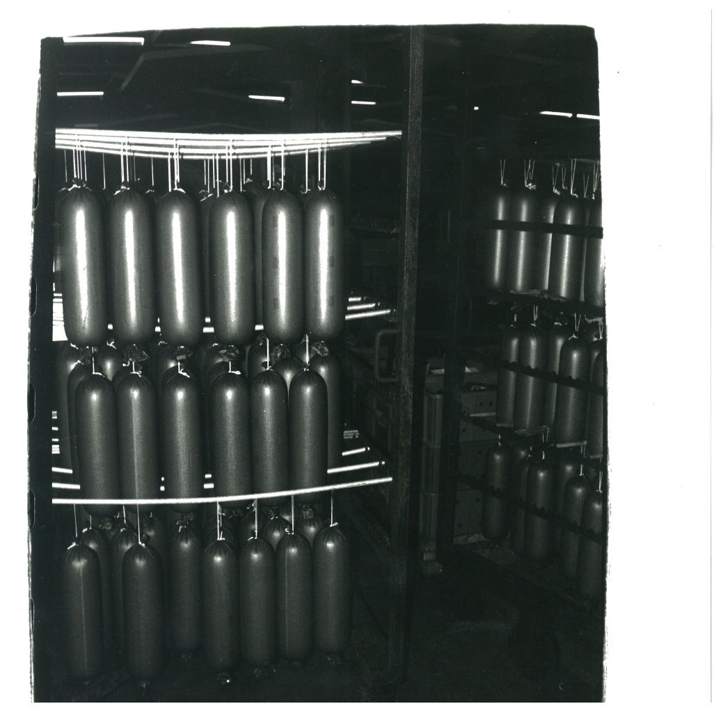 Andy Warhol Black and White Photograph - Sausages in German Factory