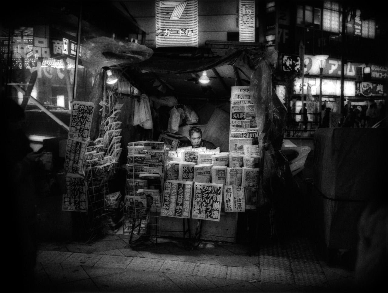 James Whitlow Delano Landscape Photograph - Newsstand at Night, Shinjuko, Tokyo