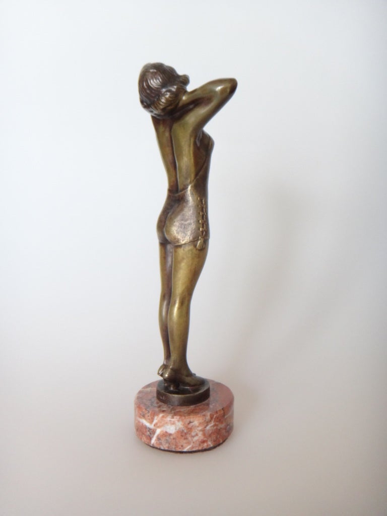 Art Deco bronze sculpture with brown patina on marble round base. By Bruno Zach ( Austrian 1891-1935 ) Signed on the base: B. Zach
Height: 9.13 in ( 23,2 cm ), Diameter 2.56 in ( 6,5 cm )
