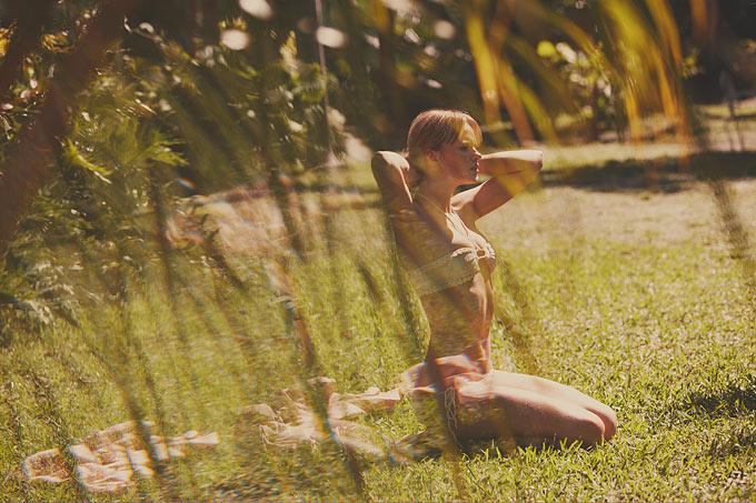 Anne 3 - model sitting in bikini on grass on a hot summer day