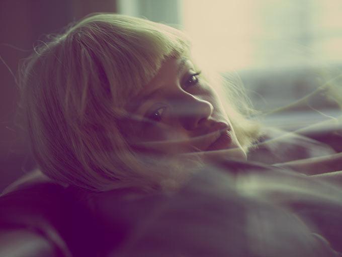 Guy Aroch Still-Life Photograph - Ginta 3 - model with blond hair in front of window looking 