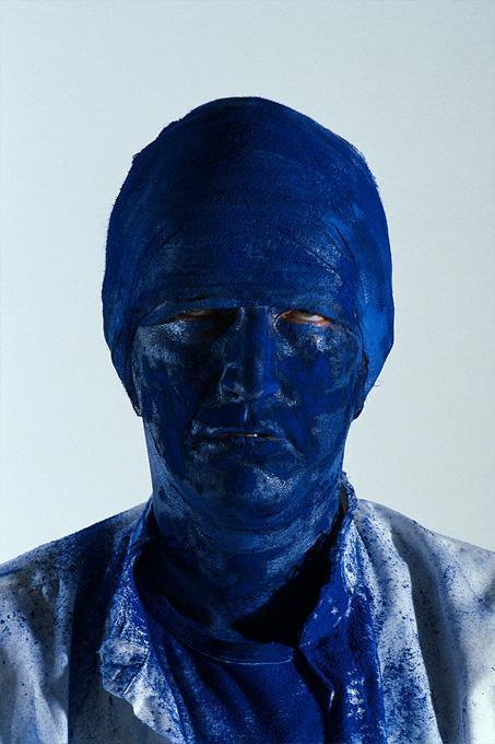Gottfried Helnwein Portrait Photograph - Glueckspilz - portrait of a man with a blue mask on and painted in blue