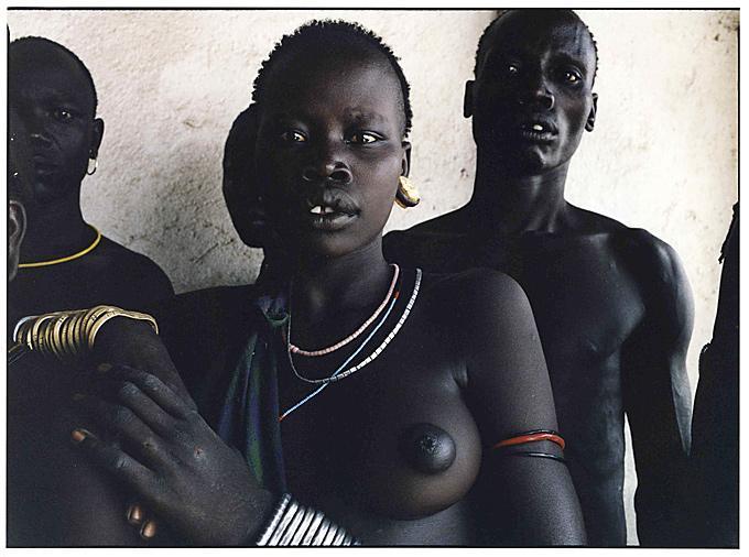 Mursi Tribe Members, Jinka, Ethiopia - Photograph by Christian Witkin