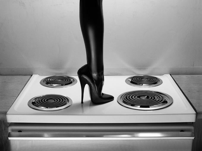 Albert Watson Portrait Photograph - Heel on stove top, Budget Suits, Las Vegas (2000) - fine art photography