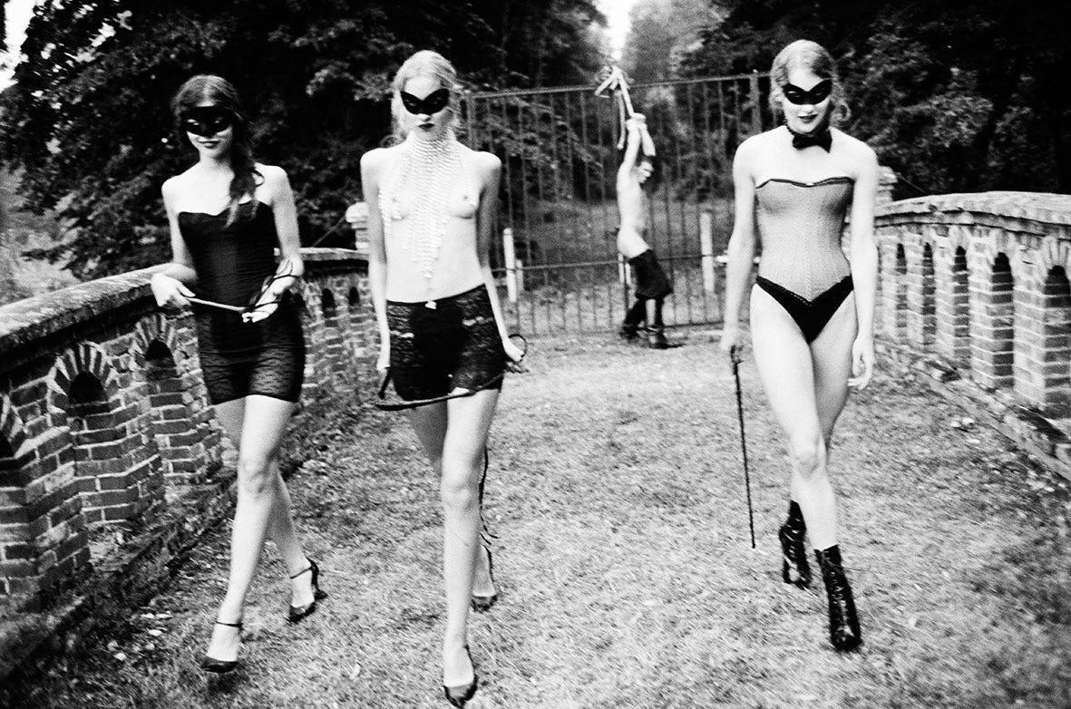 Ellen von Unwerth Black and White Photograph - 'Punishment' - seminude with masks outdoors, fine art photography, 2002