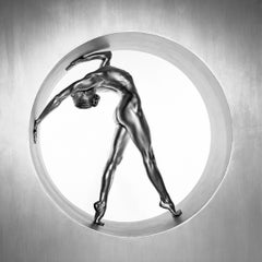 Heimarmene - A female dancer bending, painted silver, fine art photography, 1995