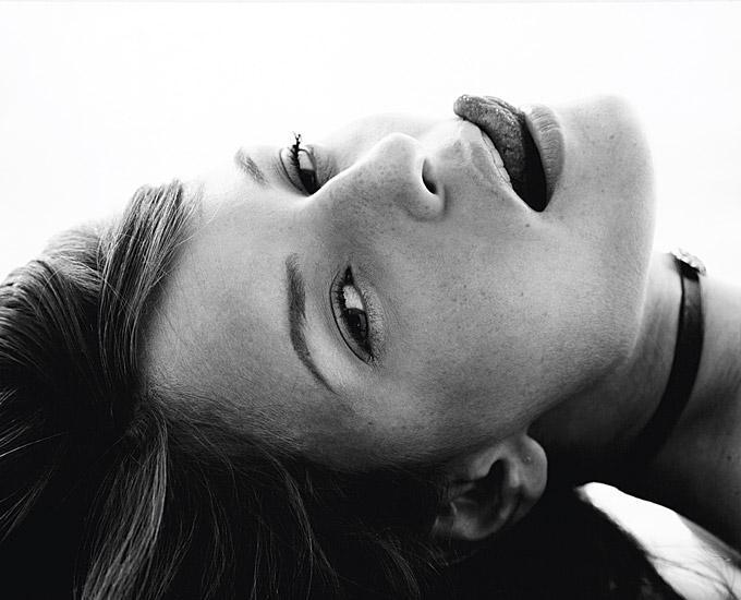 Marc Baptiste Black and White Photograph - Kiss - model lying on the floor 
