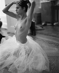 Tutu - naked woman with ballett dress sitting in a room