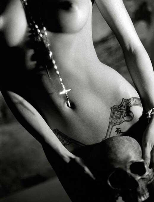 Mandy with Skull - provocative female nude portrait with religious symbols
