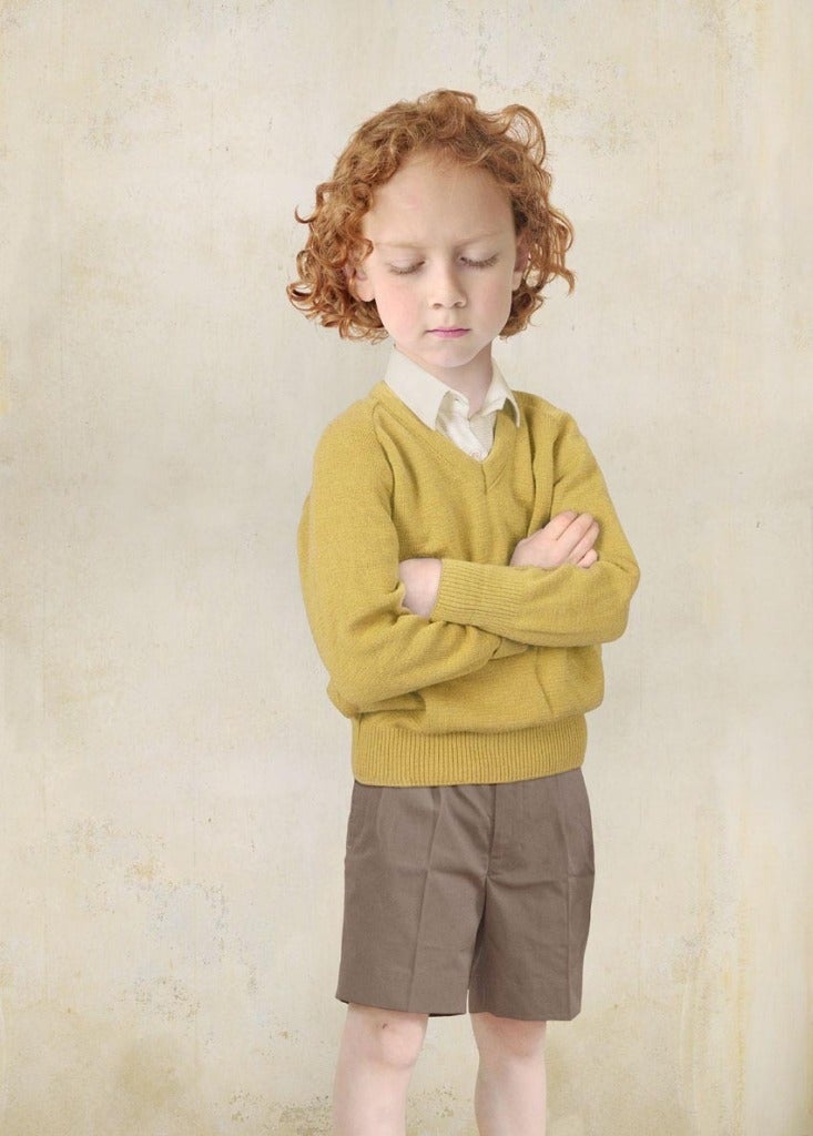 Loretta Lux Portrait Photograph - Boy in Yellow Pullover