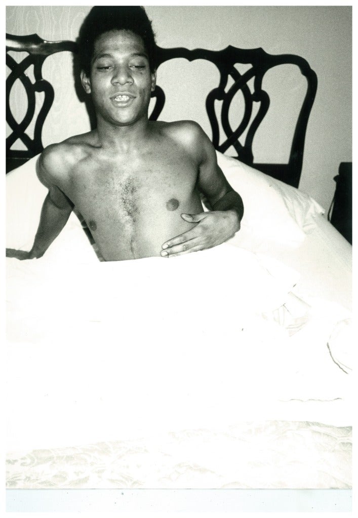 Andy Warhol Black and White Photograph - Jean-Michel Basquiat in bed