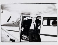 Andy Warhol exiting plane