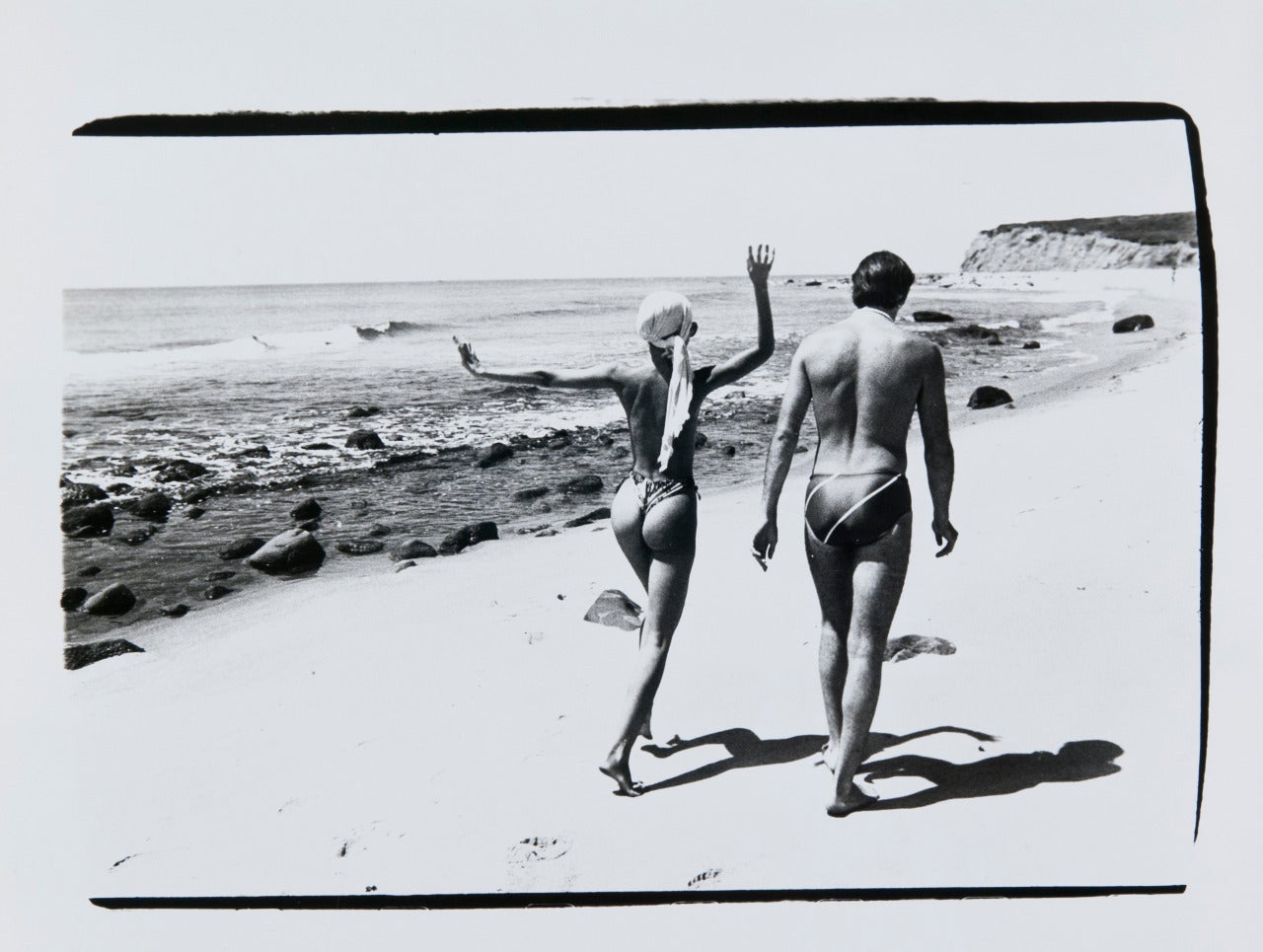 Andy Warhol Black and White Photograph - Pat Cleveland and Jon Gould at the Beach